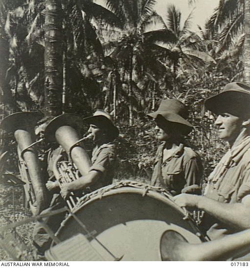 New Guinea. 26 May 1944. Australian troops who occupied the Japanese base of Alexishafen playing their instruments bringing music to the jungle.