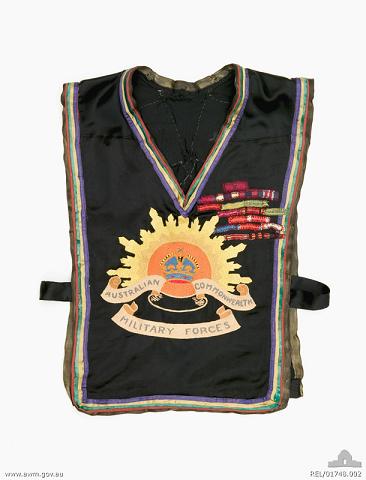 Front of the embroidered tabard, part of the patriotic fancy dress made for Mrs Rattigan featuring an embroidered Rising Sun badge (REL/01748)