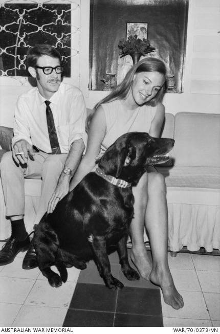 Tiber with his new owners, Gordon and Roslyn Selleck, who were working at the Australian Embassy in Saigon in 1970. Tiber has his Vietnam campaign ribbons on his collar. WAR/70/0373/VN