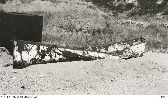 Gallipoli, Turkey. 1919. One of the original boats used by Australian troops in the landing at Anzac Cove lying battered and rusty on the beach four years later. 