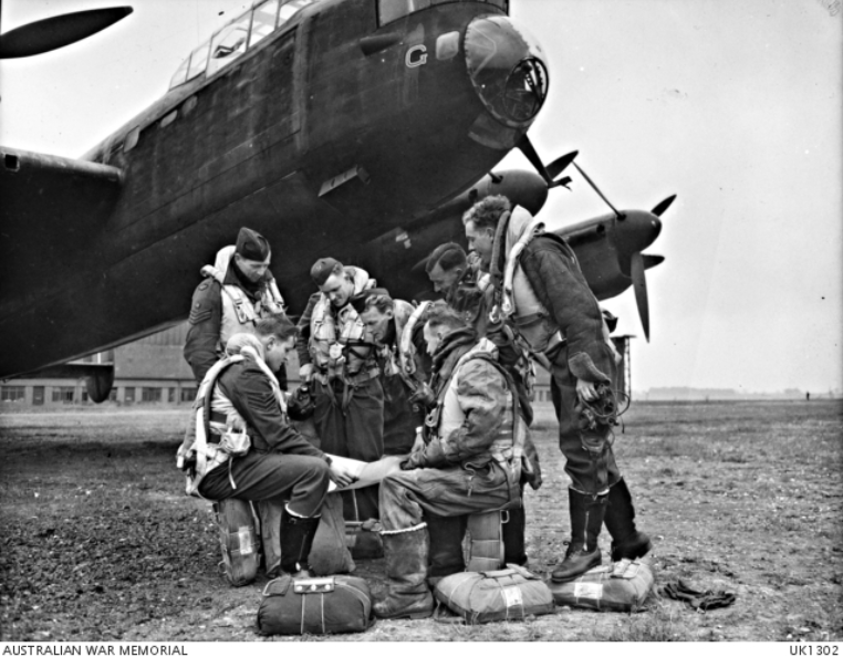Members of the crew of "G" for George, the veteran Lancaster aircraft of 460 Squadron RAAF in the UK, in front of their aircraft. The crew are preparing for either the second last or last flown operation on the 10 or 24 April 1944 before G George was retired from operational service. Left to right back row: 424050 Flight Sergeant (F Sgt) A G Brown, Sydney, NSW; 426771 Flying Officer (FO) R G Sampson, Mackay, QLD; 401614 FO J A Critchley DFC, Melbourne, VIC; Sergeant (Sgt) Shaw, RAF, Ramsgate, England; Sgt K