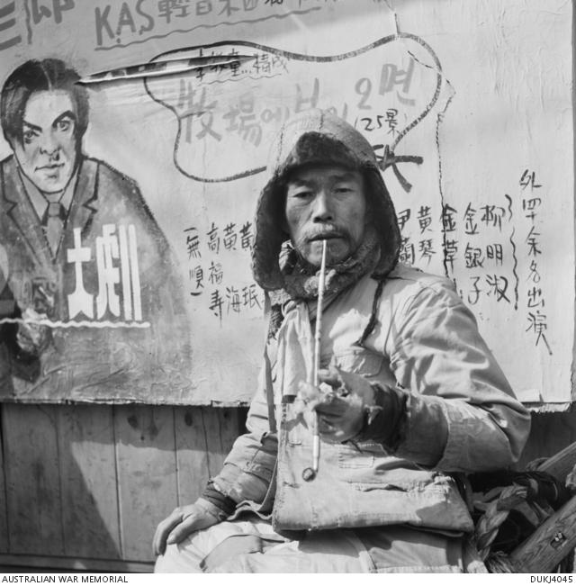 "Harold Dunkley, Portrait of a South Korean man smoking a pipe, c. March 1951 "