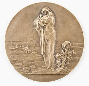 Grieving woman and child at a soldier's grave