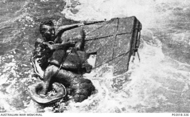 Man clinging to a raft