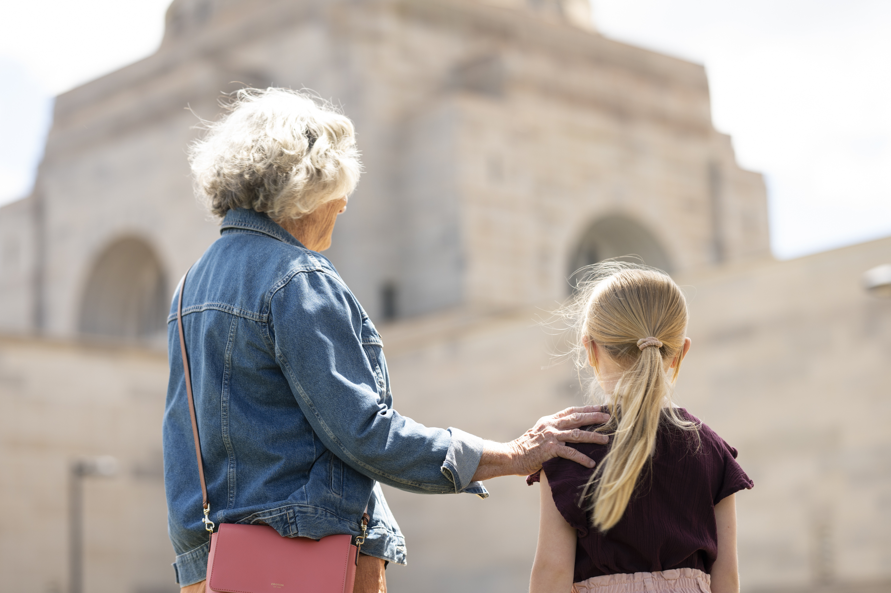 Woman and young girl looking at the Hall of Memory dome
