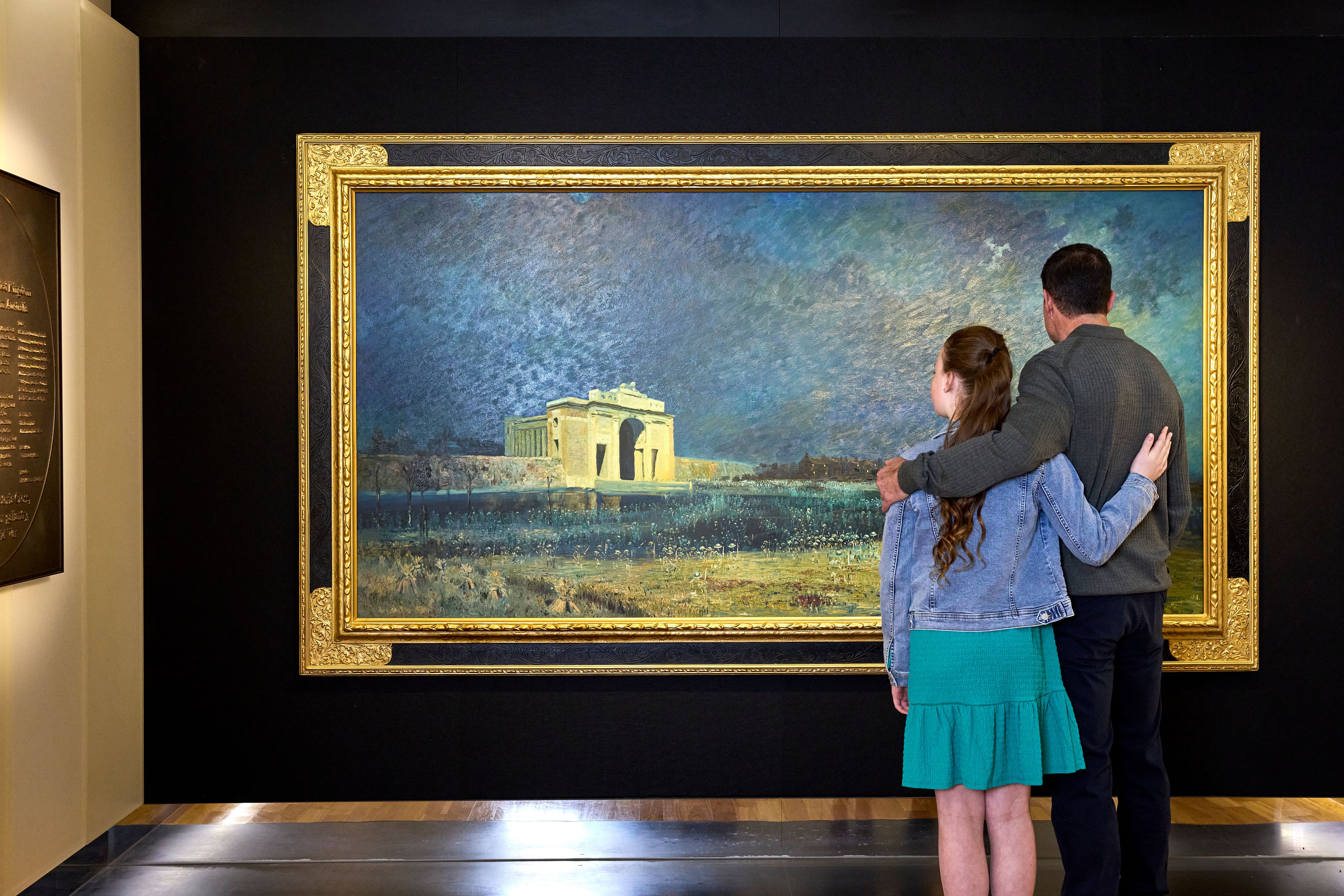 Father and daughter looking at the Menin Gate at midnight artwork