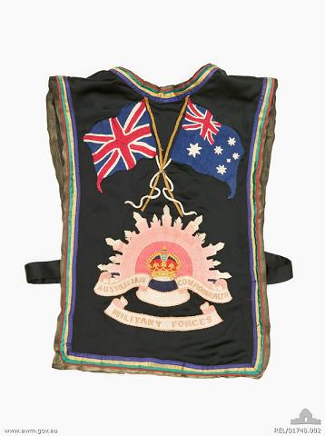 Back of the embroidered tabard, part of the patriotic fancy dress made for Mrs Rattigan featuring an embroidered Rising Sun badge and flags (REL/01748)