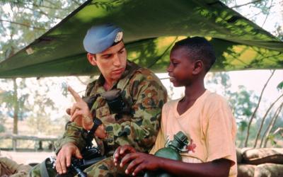 Private Trent Burnard with a local boy in Kigali, 1994