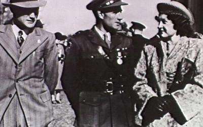 Captain Bede Tongs (centre) with his wife and his brother Reginald after being presented his Military Medal by the Governor-General in Canberra, July 1947.