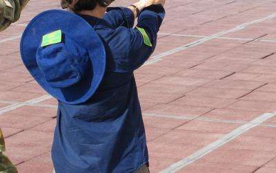 Learning to fire a pistol at the practice range with Captain Stuart, photo by G1