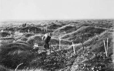 An Australian soldier among the scattered battlefield graves at Pozieres. Some 23,000 Australians became casualties in this fighting, of which 7,000 died