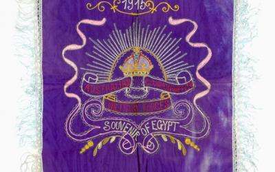 Purple machine chainstitch embroidered souvenir with the Australian Rising Sun Badge. Above the badge is the text '1915' and underneath is 'SOUVENIR OF EGYPT'.