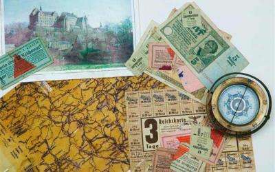Items from Lieutenant JR Jack Millet’s Colditz collection, including hand-drawn escape maps, currency and a compass