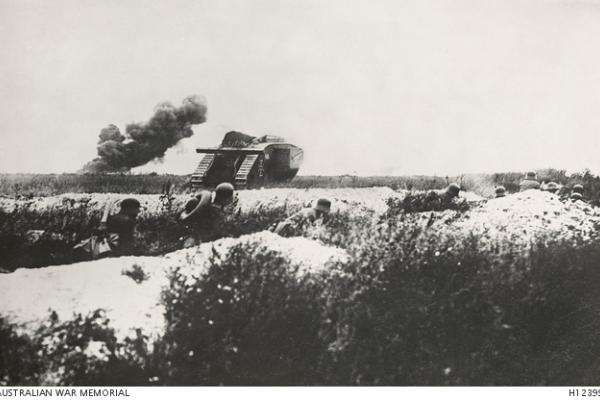 Western Front, France. A British tank captured by the German Army being used by the Germans to support an attack.