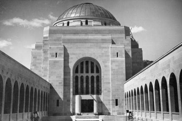 Canberra, ACT. c. 1941. The completed courtyard and copper dome of the Hall of Memory at the Australian War Memorial. Note the artisans working on the wall sculptures below the Cloisters.