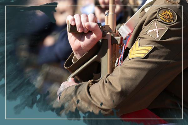 Close-up image of army soldier with rifle