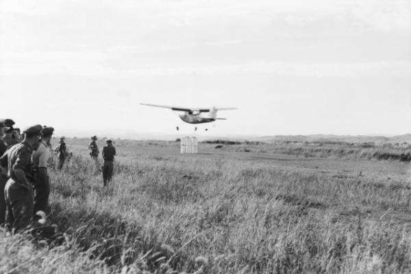 Pilots of light liaison aircraft serving with Australian and other Commonwealth troops in Korea celebrated the Battle of Britain anniversary by playing an 'aerial cricket' match against American Army pilots. The large wickets with bails are beneath the aircraft.