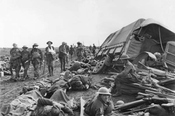 The wounded on the stretchers are waiting to be taken to the clearing stations while others walk as far as they can