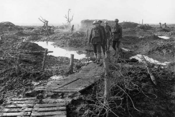 Australian troops walking along a duckboard track near Zonnebeke