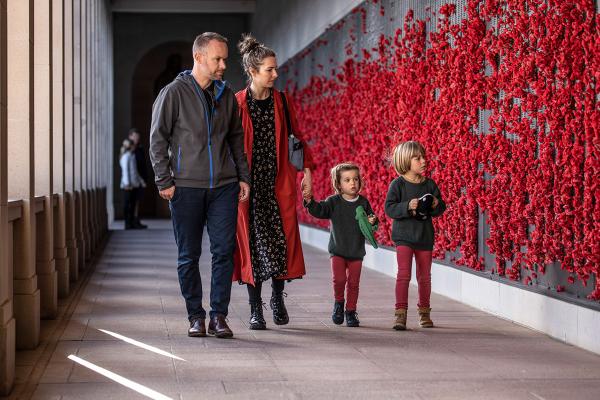 Family looking at the Roll of Honour