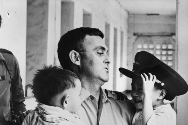 RAAF Chaplain John White with orphans at a Vung Tau orphanage.