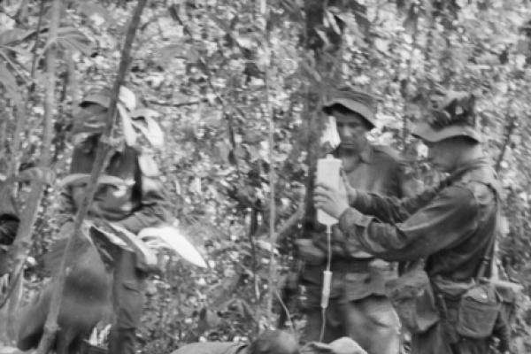 Treating a wounded Australian soldier in the field, February 1966