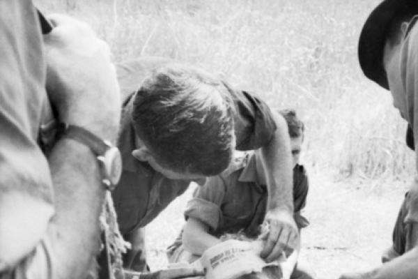 Treating an Australian soldier with a head wound in the field, 18 March 1966