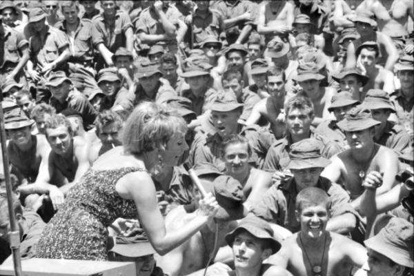 Singer Lorrae Desmond performing at a concert for troops, Nui Dat, 1967