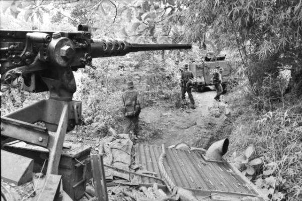 Armoured personnel carrier and troops pursuing Viet Cong after the Battle of Long Tan, Operation Smithfield, 19 August 1966