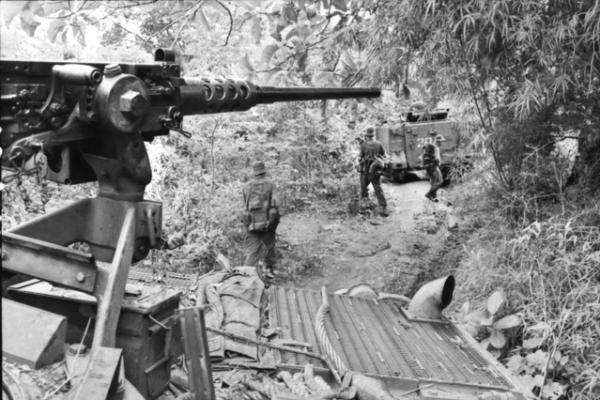 Armoured personnel carrier and troops pursuing Viet Cong after the Battle of Long Tan, Operation Smithfield, 19 August 1966