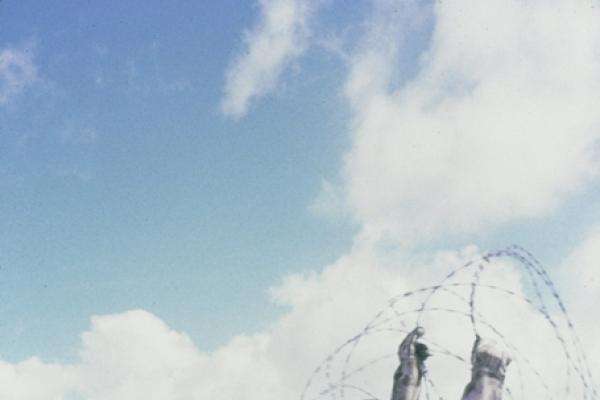 Australian troops and South Vietnamese militia erecting a barbed wire fence alongside the minefield between Phuoc Hai and Horseshoe Hill, May 1967