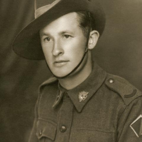 Studio portrait of Gunner Edward Michael John O'Neill, 2/4 Light Anti Aircraft Regiment, RAA, of Taralga, NSW. Photo: Australian War Memorial. Accession No. P08889.001