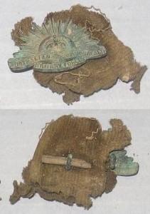 Front and back of the collar badge, showing the piece of wood (RELAWM07839.001)