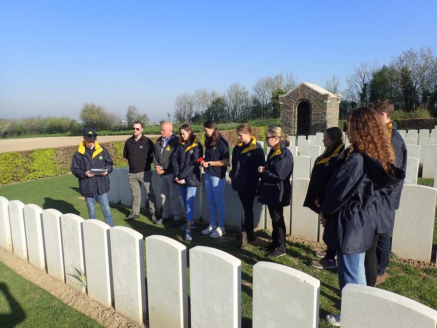 Jett Aplin reads an account of a soldier at Adelaide Cemetery in Villers-Bretonneux.