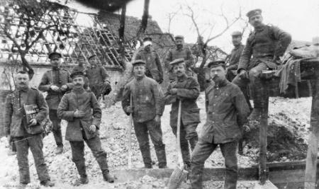 A group of German engineers preparing mines in a French village before withdrawing to the Hindenburg Line.