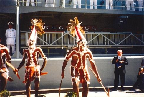 Waramungu men Darius Plummer, Cameron Plummer, and E. Kumantjayi Plummer perform a peace and welcoming dance at the launch of HMAS Warramunga in Melbourne, 1998. The men also performed a fighting dance, to give the ship and crew strength and wisdom to overcome enemies. (Jacqueline Hingston Namikili , photo courtesy of the Waramungu tribe)