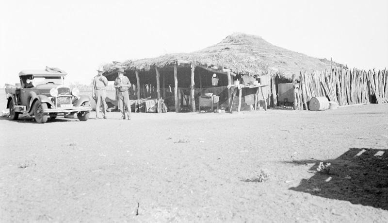 Image of old 1930 ute parked in front of old shack