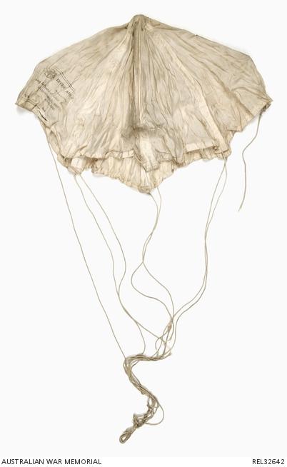 The white silk parachute used by Warrant Officer John Payne when his Spitfire was shot down by a Japanese fighter on 17 June 1944. AWM REL32642  