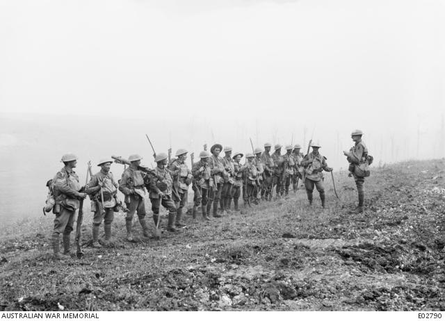 A platoon of the 29th Battalion, severely reduced in strength, receiving orders before the final advance on 8 August 1918 in the battle of Amiens.