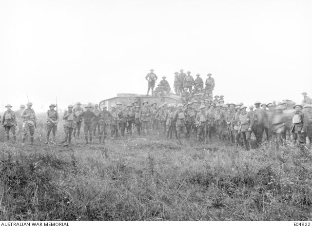 Men of the 5th Brigade gather around a British tank following the success of the first phase of the attack on 8 August 1918.