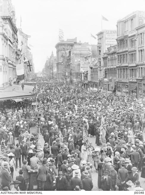 Crowds fill the city streets in Melbourne on Armistice Day, 11 November 1918. J00348