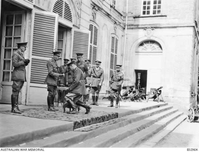 His Majesty King George V, knighting Lieutenant General Sir John Monash outside the Australian Corps Headquarters at Bertangles, France, 12 August 1918