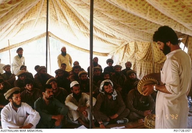 Pakistani and Afghan mine clearing personnel listen to a lecture, Pakistan, 1992.