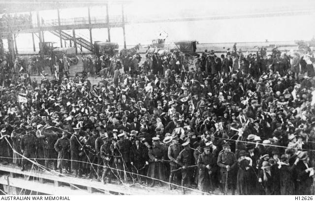 A large crowd on the pier at Port Melbourne farewells Australian soldiers departing for the First World War on the troopship Themistocles in December 1914.