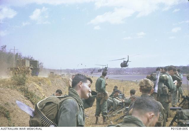 Soldiers of the 7th Battalion, Royal Australian Regiment (7RAR), wait for the helicopters that will take them to the starting point for Operation Coburg.