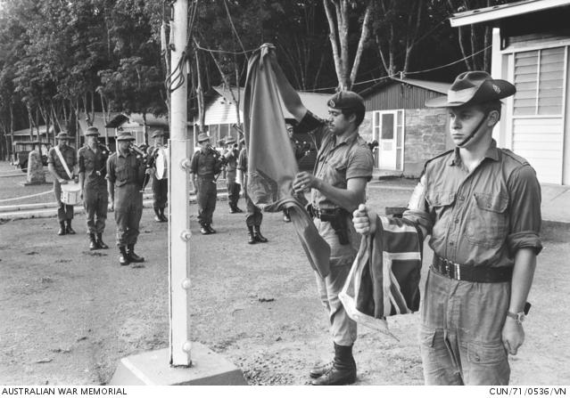 Lowering the Australian flag for the last time at Nui Dat,