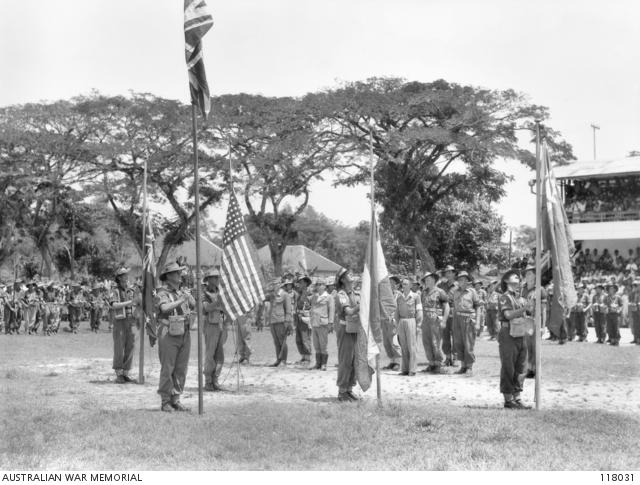 Flags are raised at the commencement of the surrender ceremony.
