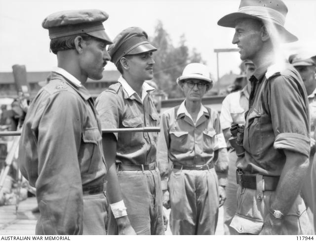 Lieutenant Colonel Murray Robson interviews Indian ex–prisoners of war at Bandjermasin.