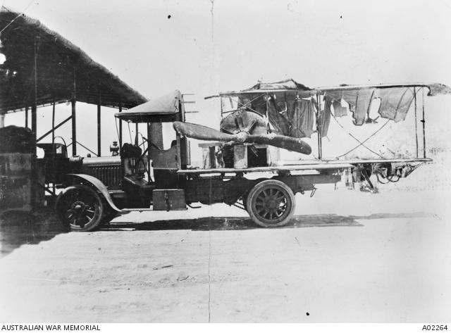The remains of the Caudron G III aircraft being transported on the back of a truck