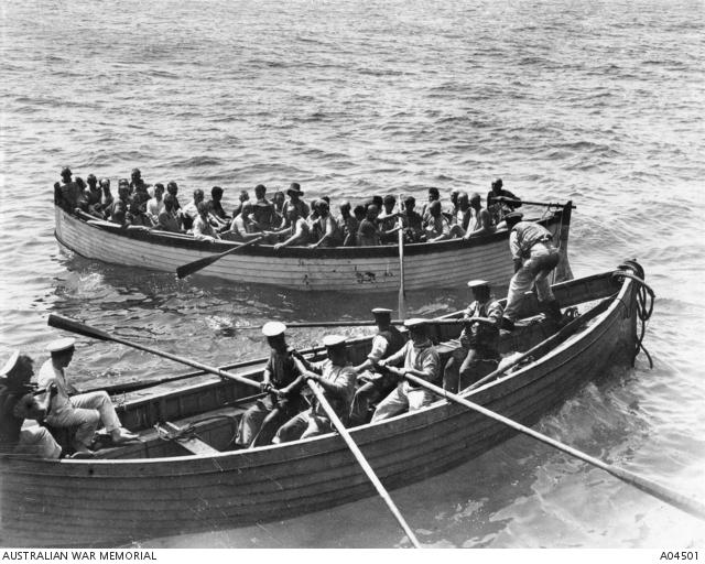 A lifeboat from the Ben-My-Chree passing a line to a lifeboat full of Australian troops from the troopship HMT Southland.